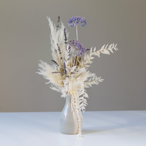 Simple but elegant dried arrangement in a ceramic vase