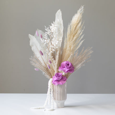 Beautiful Petal Duet designed a textured ceramic vase and includes dried elements such as preserved roses, bunny tails, skeleton leaves, ruscus, amaranthus and more!