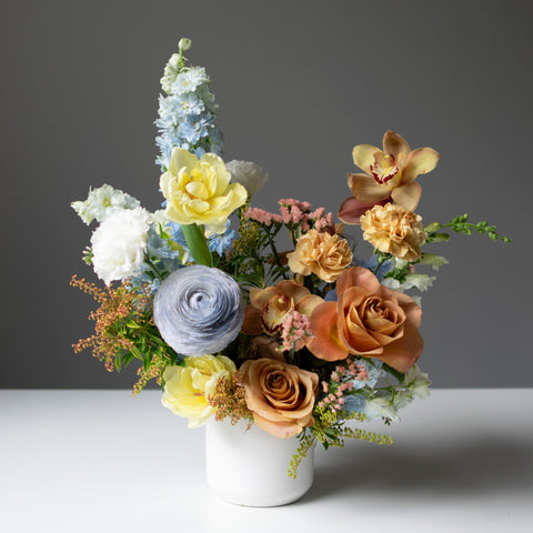 Subtle fresh flower arrangement in pastel & muted neutral colours