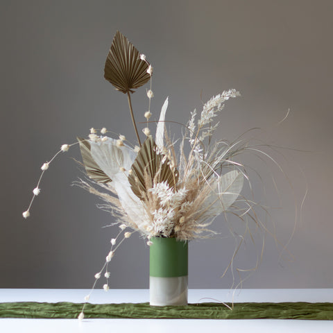 Beautiful Sonnet Dried Arrangement. Comes in a smooth matte finish green and white ceramic vase