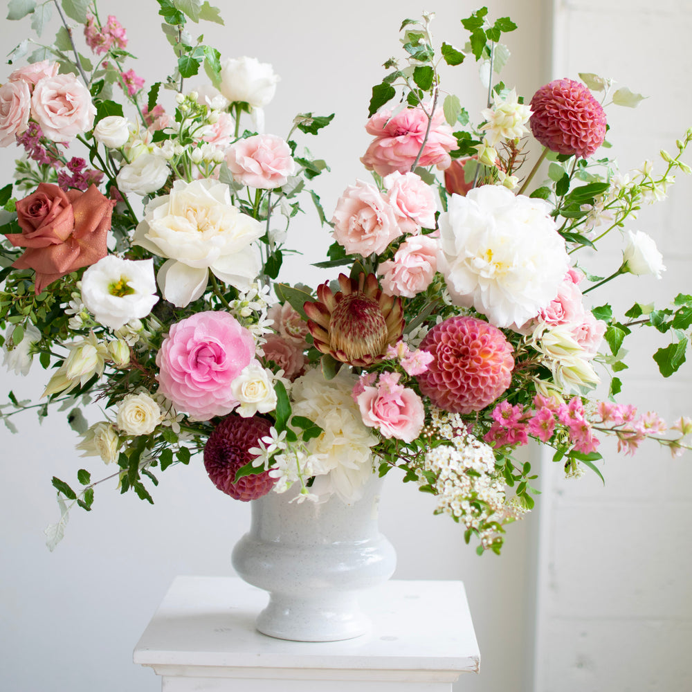Close up of flowers in Sympathy Urn with a pink, white and peach colour palette. 