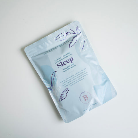 A light blue package containing lavender and fresh mint bath salts.