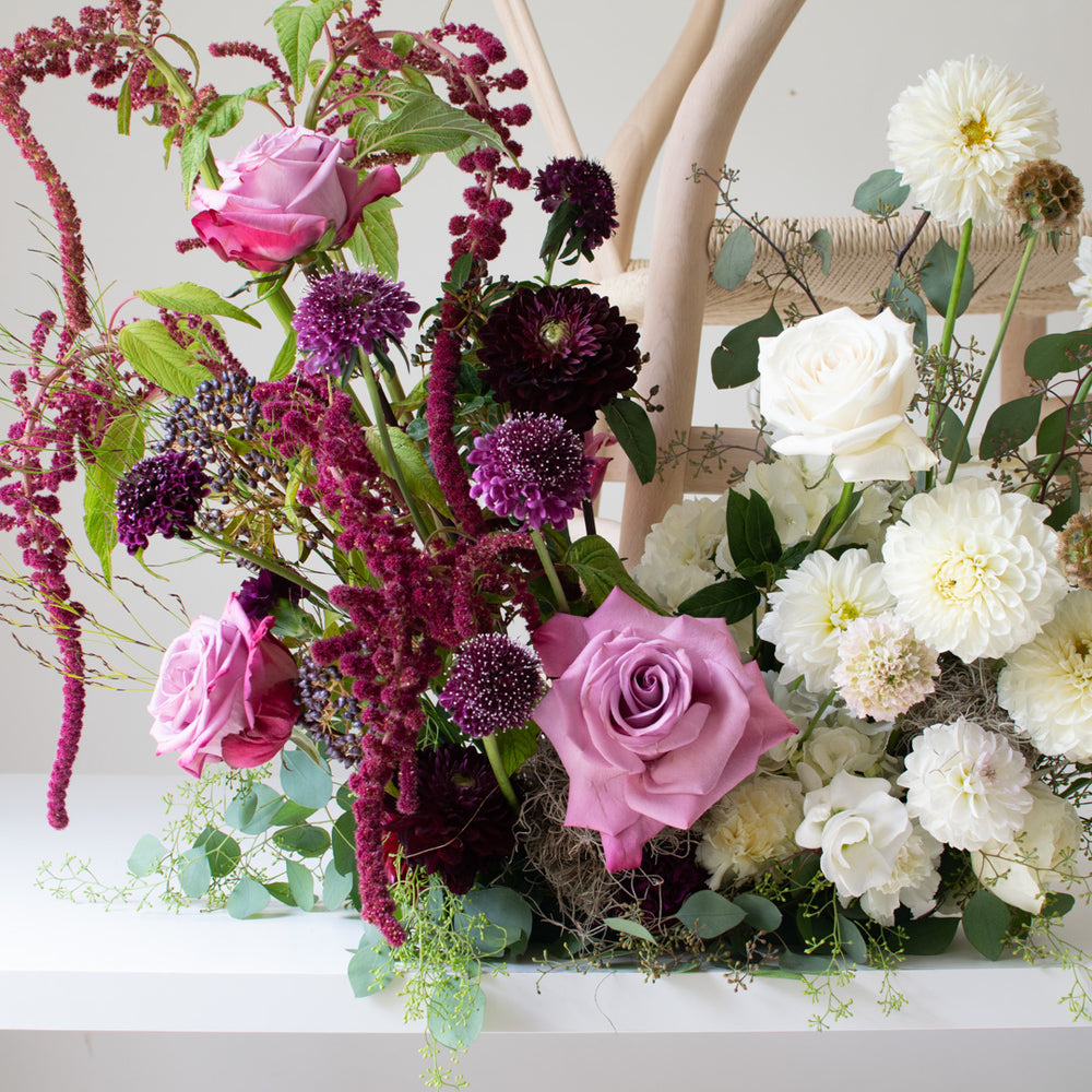A close-up of deep purple and white flowers.