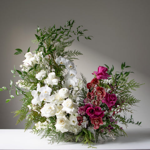 Stunning large split palette floral arrangement for weddings with whites and rich jewel tones.