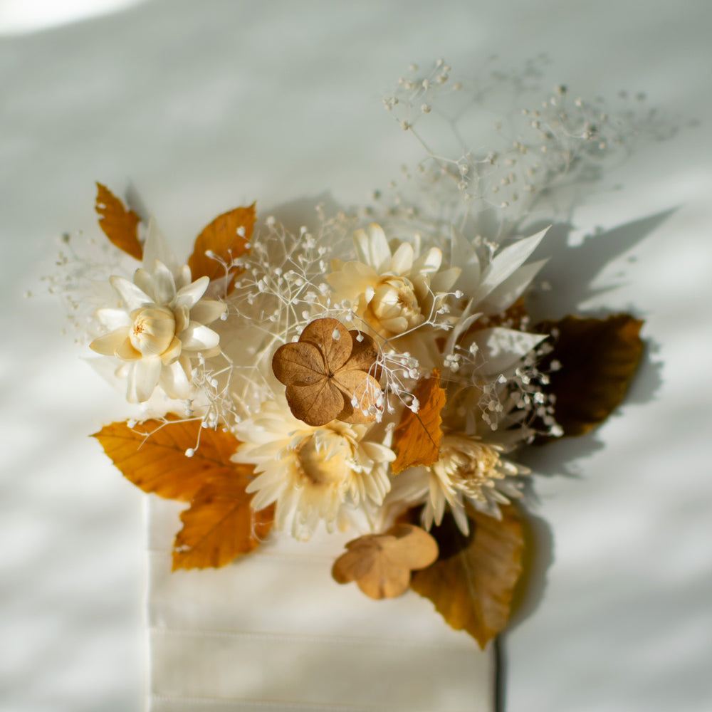 A close up of the delicate flowers used in a pocket boutonniere.
