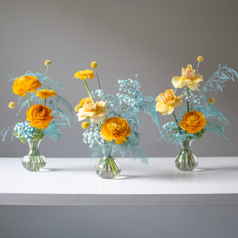 Three clean, simple arrangements with a orange colour pallette & blue accents
