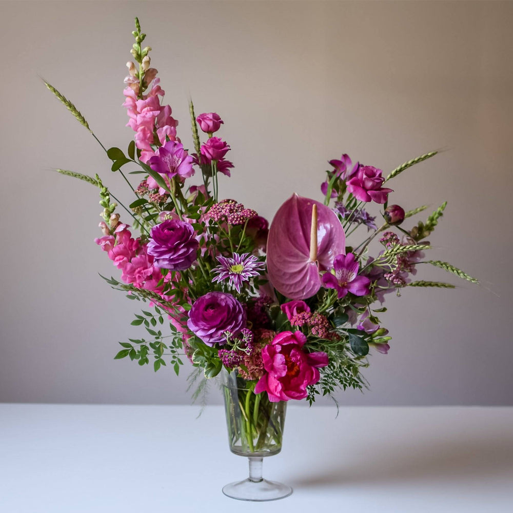 Standard Footed Glass Vase Arrangement with rich and bold palette.