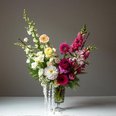 Standard Footed Glass Vase Arrangement can be delivered anywhere in Toronto.